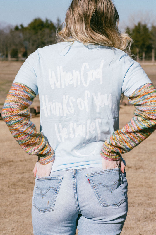 When God thinks of you He smiles! Unisex T-shirt!